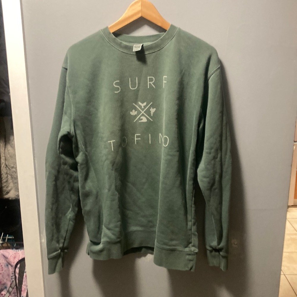 Independent trading company sweatshirt with surf Torino  on it in green